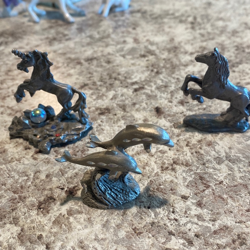3 mini Pewter pieces , a horse , a unicorn , and dolphin’s